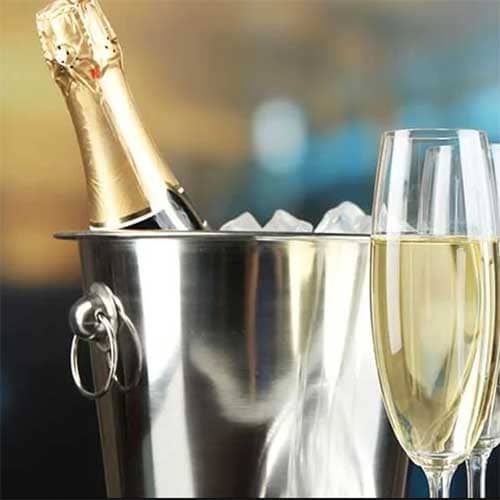 Champagne on ice beside a poured glass, served with afternoon tea at Sheene Mill